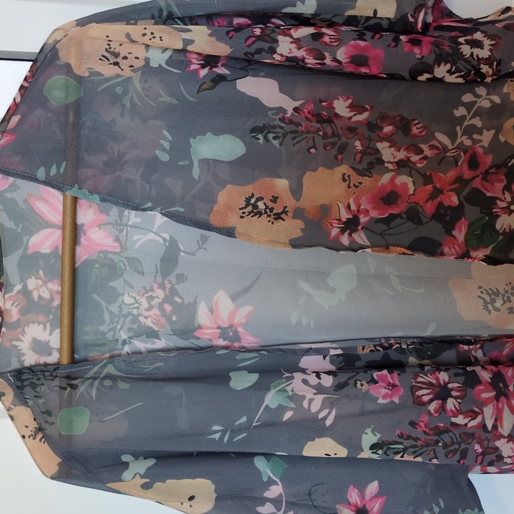 Kimono. Light grey background with flowers. Size small. See through